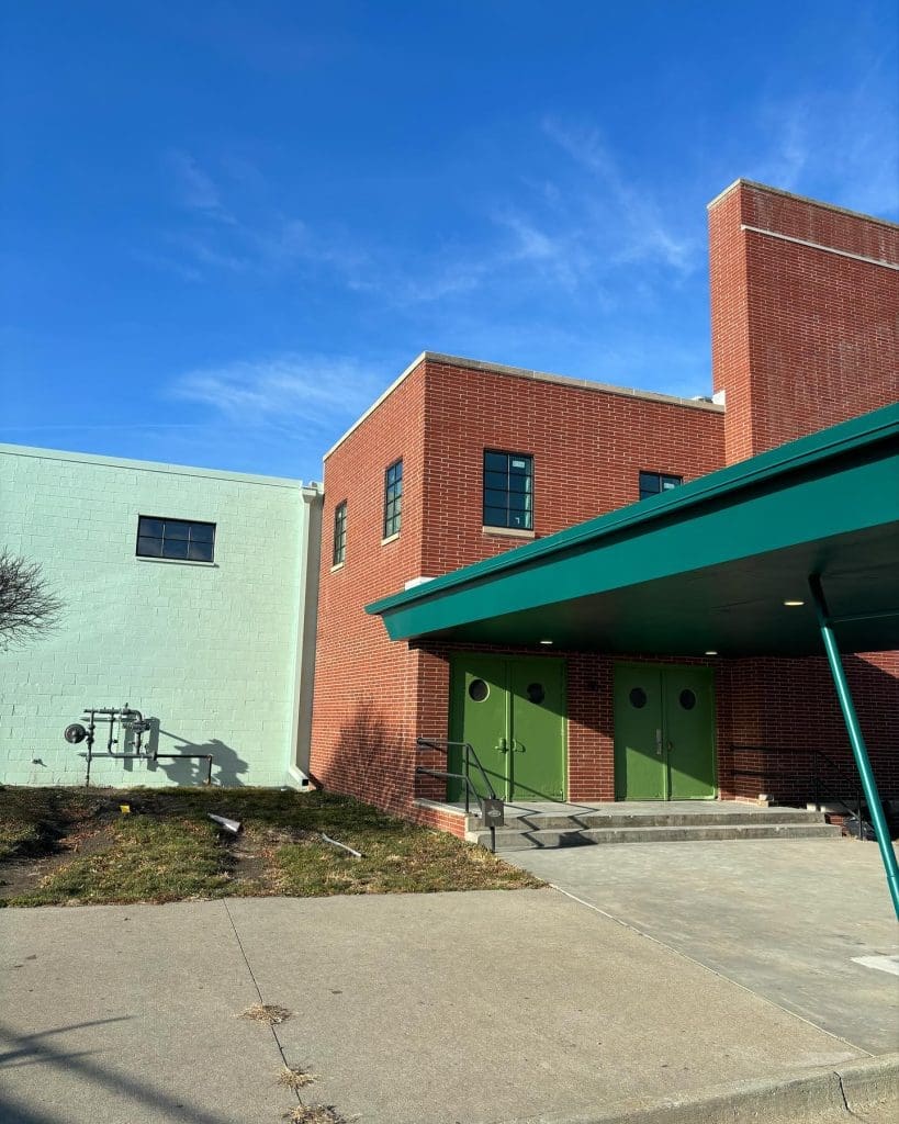 The building in the image with brown blocks